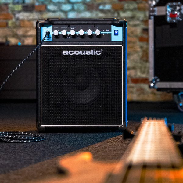B25C combo bass amp with a guitar on the floor