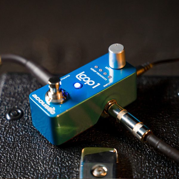 close up view of LOOP1 looper pedal on top of amp beside its handle