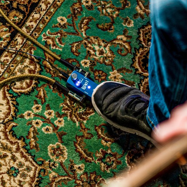 guitar player performing with LOOP1 looper pedal